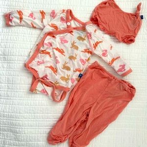 Newborn kickee pants onesie with matching footed pants and hat.
